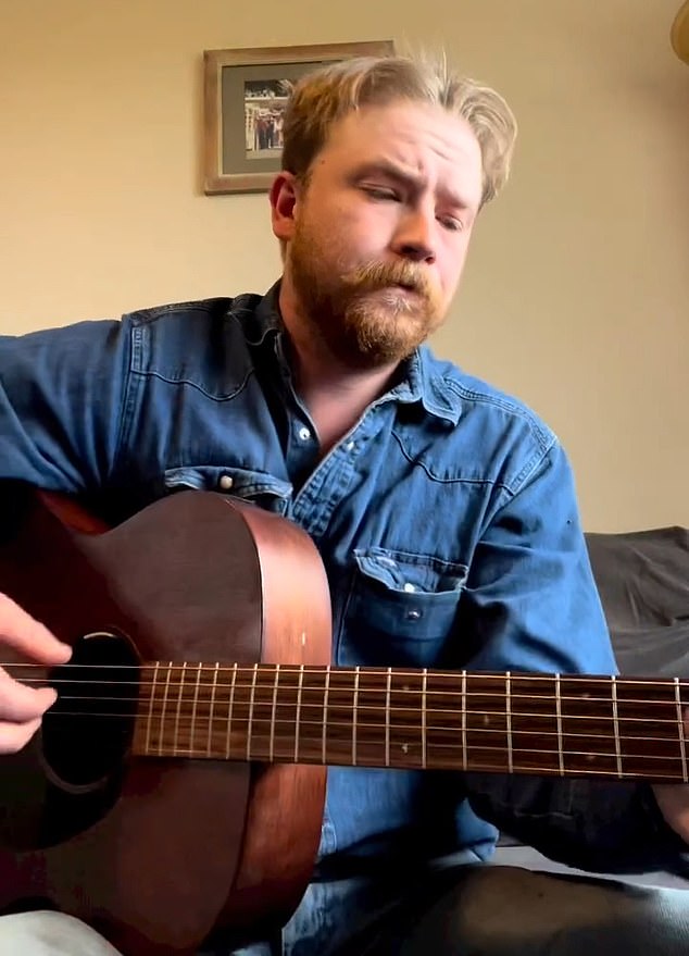 Colter Wall playing guitar onstage, pausing his remaining 2026 dates for mental health.