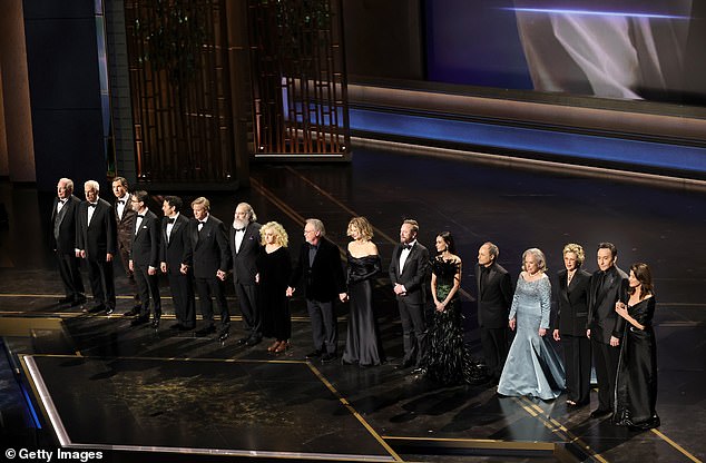 A widely shared stage photo from the Oscars tribute segment; online commenters speculated it shows Daphne Zuniga alongside Meg Ryan and Annette Bening, but identities were not confirmed at press time.