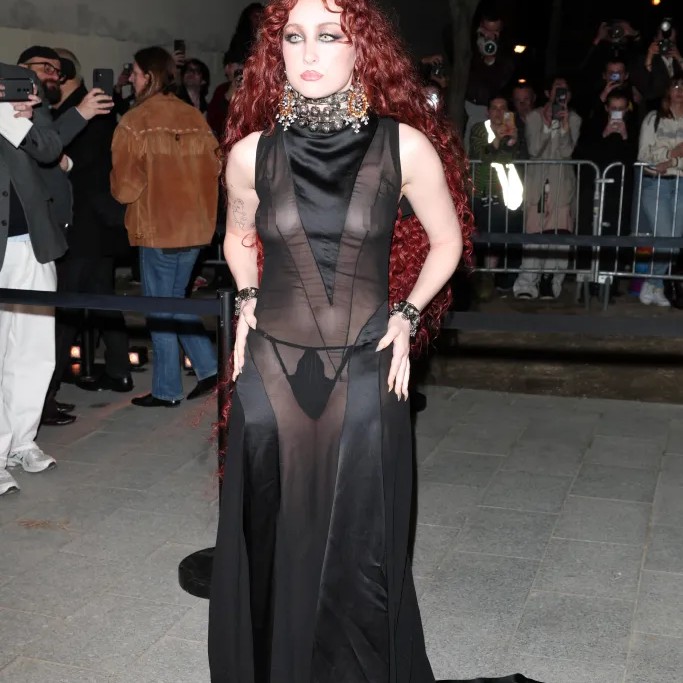 Chappell Roan wore a bold sheer black dress at the McQueen show at Paris Fashion Week Sunday. - Getty Images