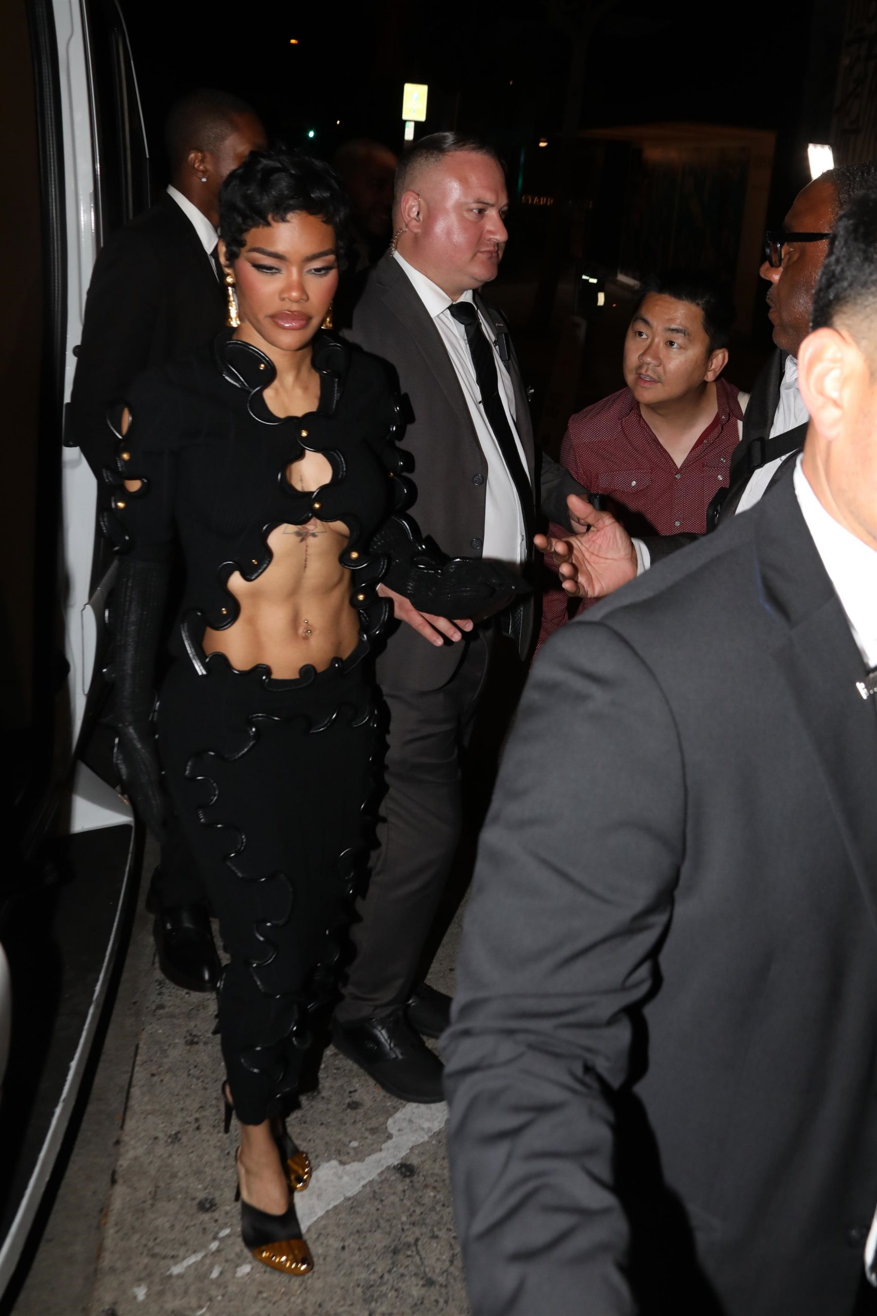 Teyana Taylor arrives at Craig's in West Hollywood wearing Schiaparelli's 'squiggle wiggle' knit set with long black gloves.