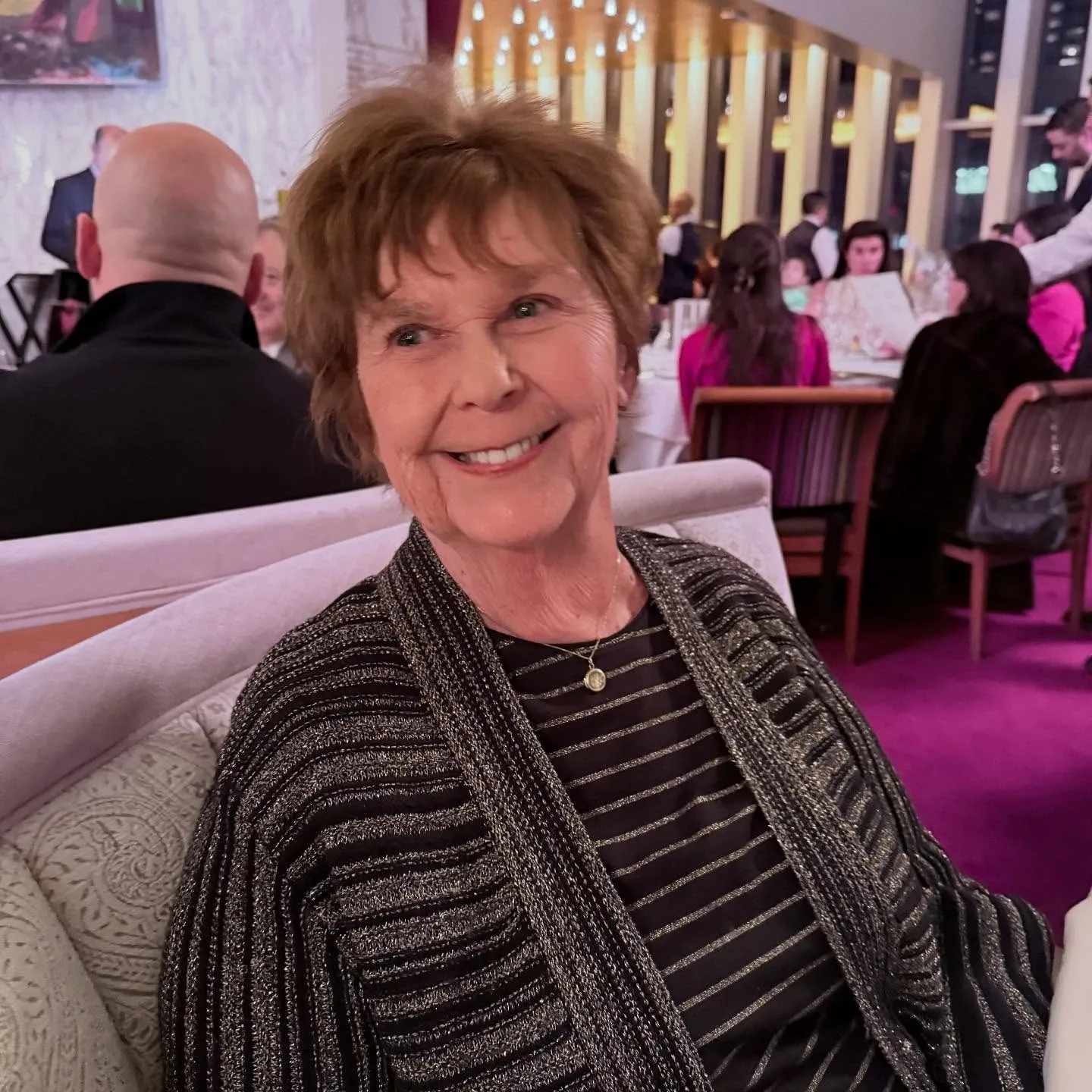Nancy Guthrie smiling at a restaurant.