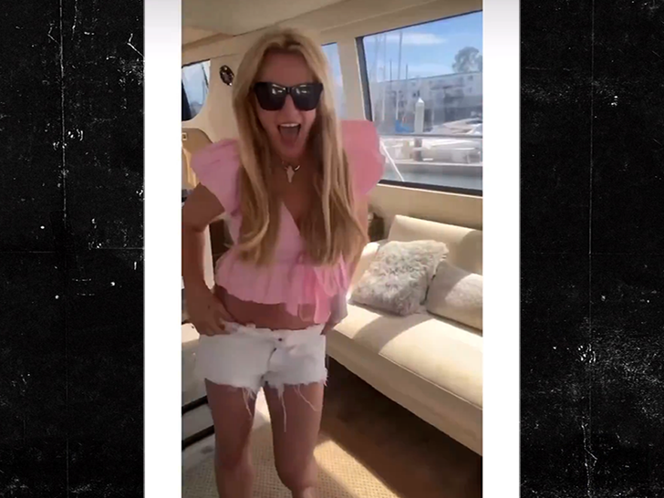 Britney Spears standing on a boat during the same Instagram video.