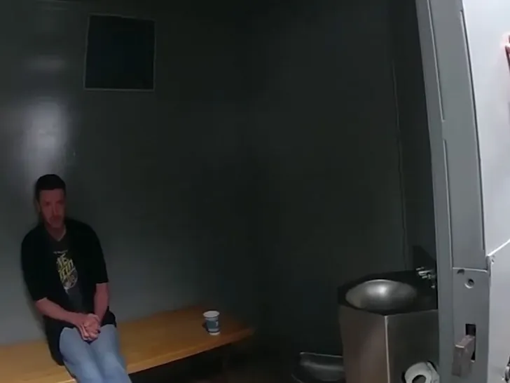 Body-cam still from Sag Harbor police shows Justin Timberlake seated in a holding cell during his June 2024 arrest.