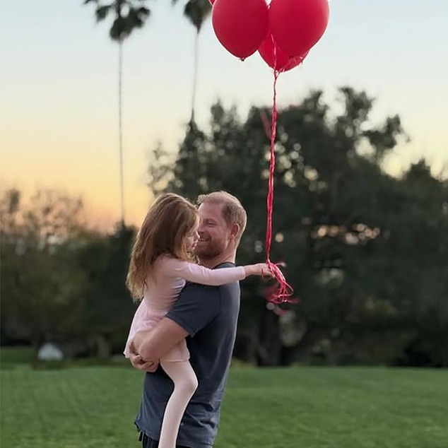 On February 14, Meghan posted another picture of Lilibet, this time cuddling Prince Harry. Lilibet's face - for once - was clearly visible, albeit in profile - Daily Mail US