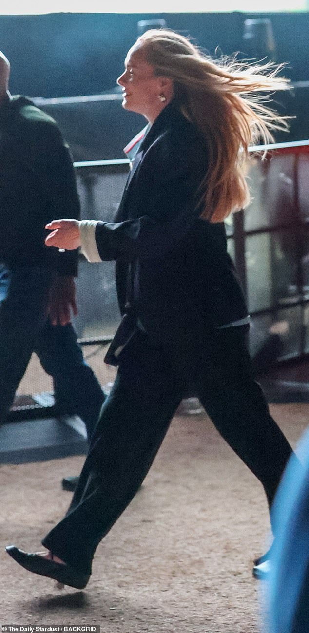 Adele keeps a low profile while walking through the Coachella grounds during Justin Bieber's Saturday headlining set (Weekend 1)