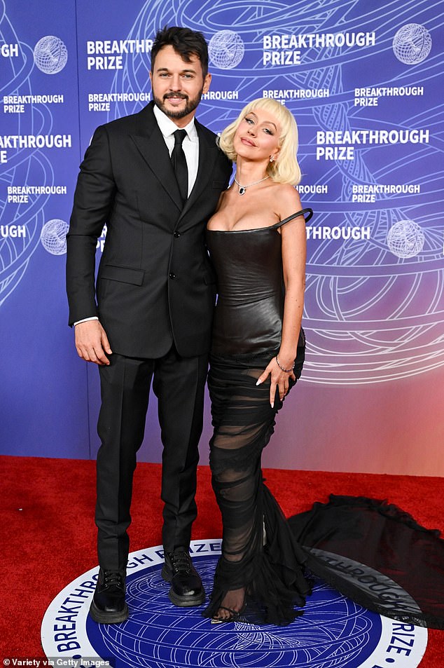 Christina Aguilera and fiance Matthew Rutler pose together at the Breakthrough Prize Ceremony.