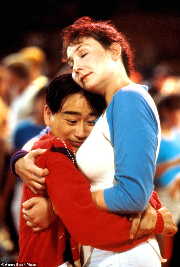 Gedde Watanabe as Long Duk Dong in Sixteen Candles (1984), with Deborah Pollack.