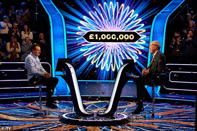 Roman Dubowski celebrates his 1,000,000 win on the Who Wants To Be A Millionaire set.