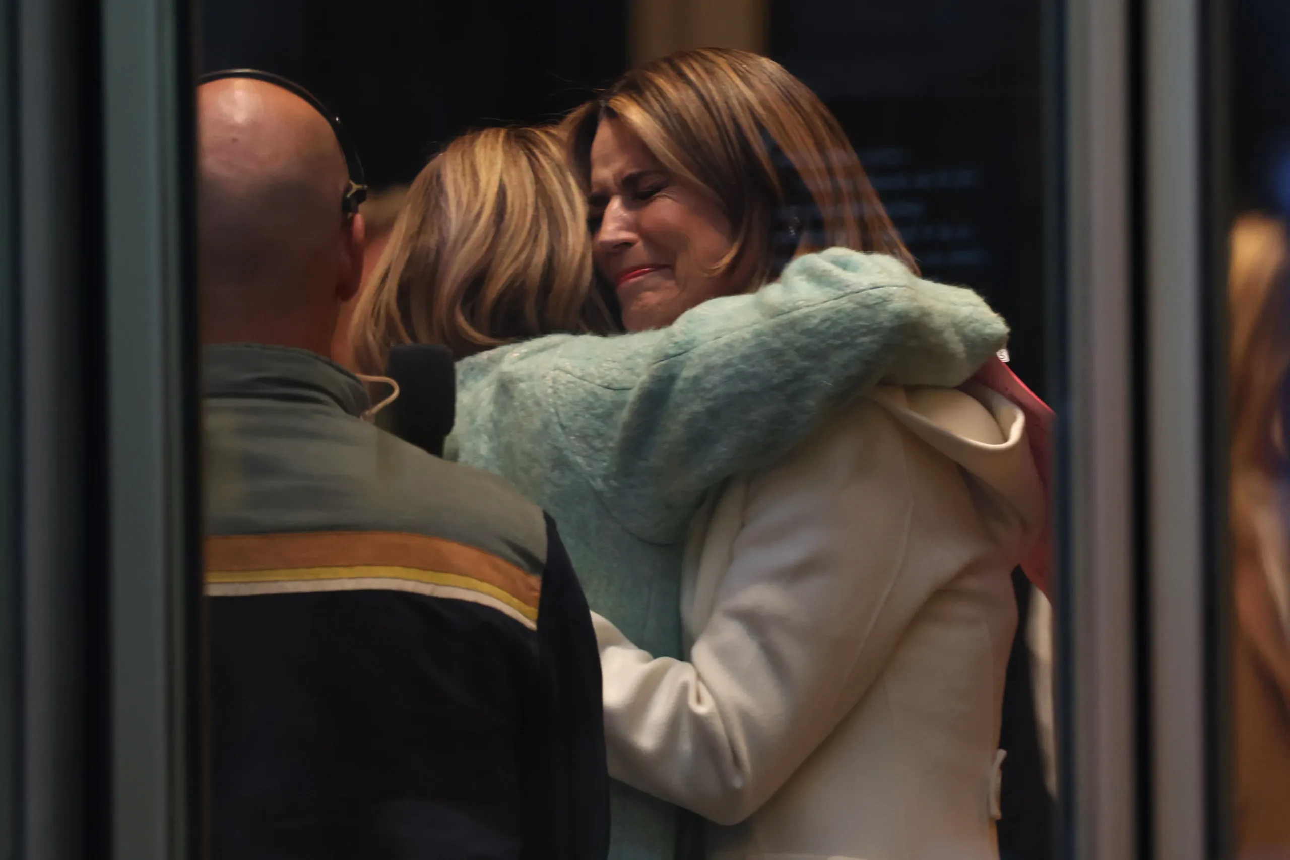 Savannah Guthrie shares an emotional hug with Jenna Bush Hager during her first day back.