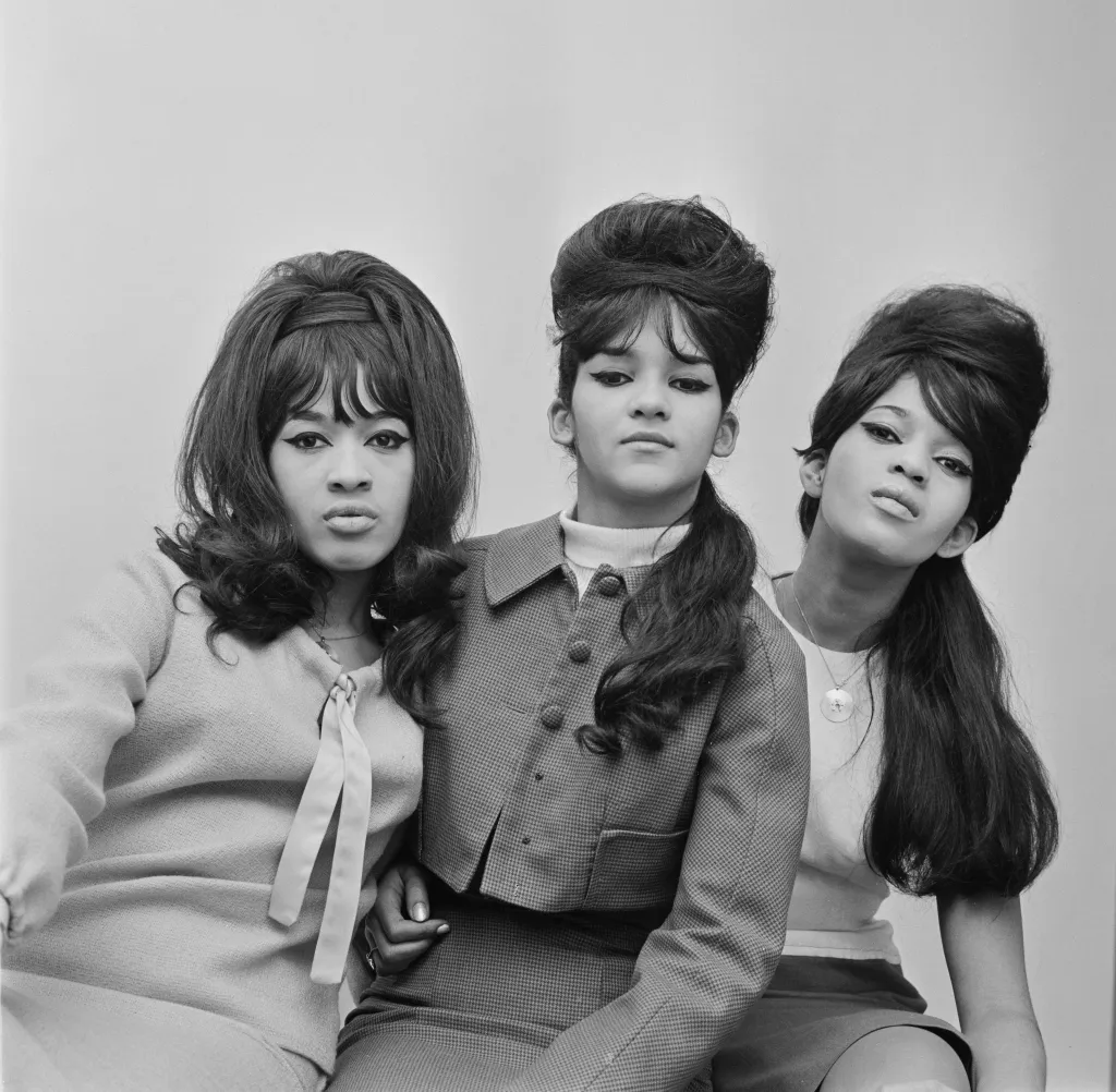 Black and white studio portrait of The Ronettes featuring Veronica Bennett (Ronnie Spector), Nedra Talley, and Estelle Bennett.